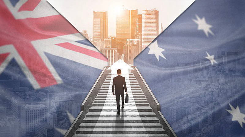 images hows businessman walking up stairs towards a city with australian flag in background